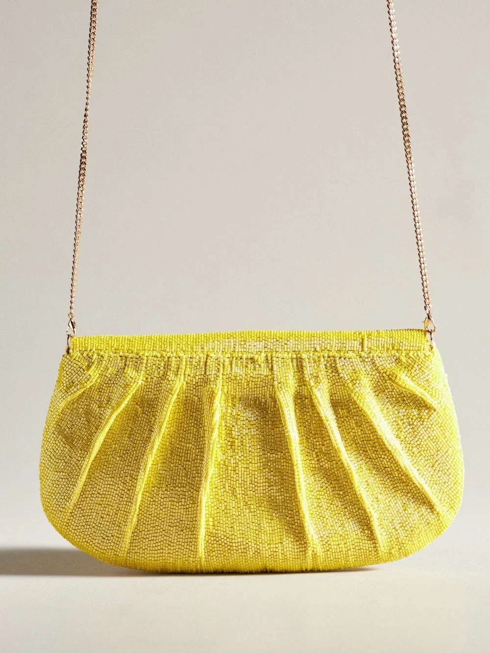 Maeve Beaded Bow Clutch in Yellow